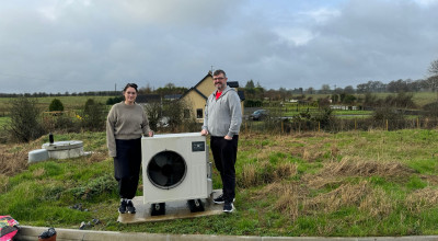 Homeowners with their Heat pump